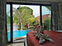 Panoramic-view-from-the-room-with-a-king-size-single-bed-overlooking-the-terrace-and-pool