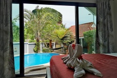 Panoramic-view-from-the-room-with-a-king-size-single-bed-overlooking-the-terrace-and-pool
