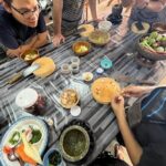 Students preparing and tasting Thai dishes in Learn Thai Cooking in Krabi class